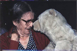 A client interacts with a bear puppet