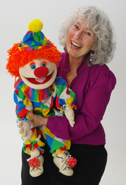 Marge Schneider with a clown puppet