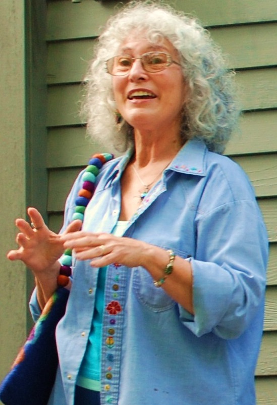 Marge Schneider speaking at an event