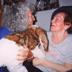 Marge Schneider helping a client with a rabbit puppet