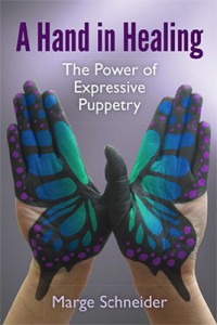 front cover of the book A Hand in Healing: The Power of Expressive 
Puppetry